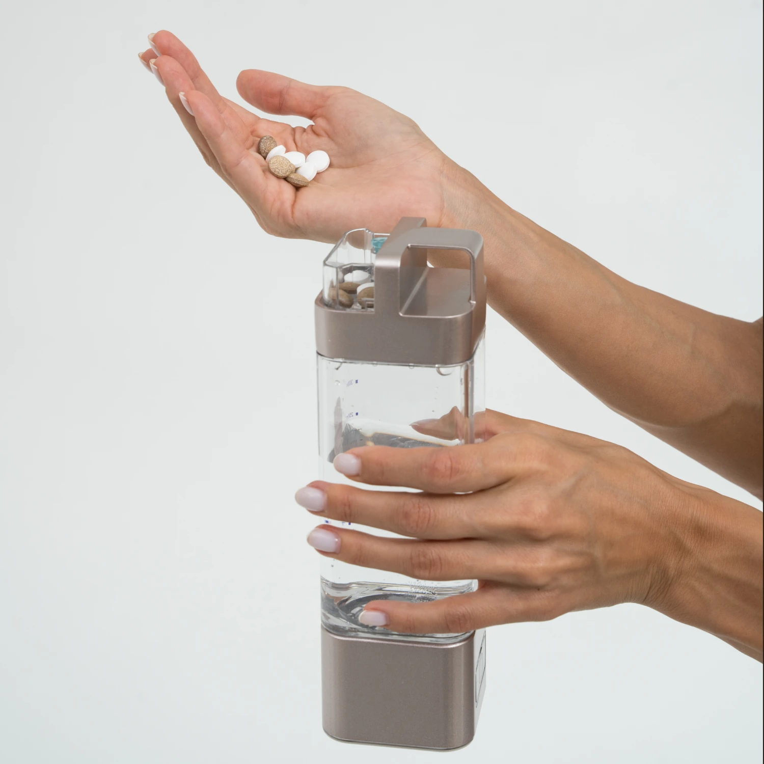 Adding daily vitamins at the bottle lid