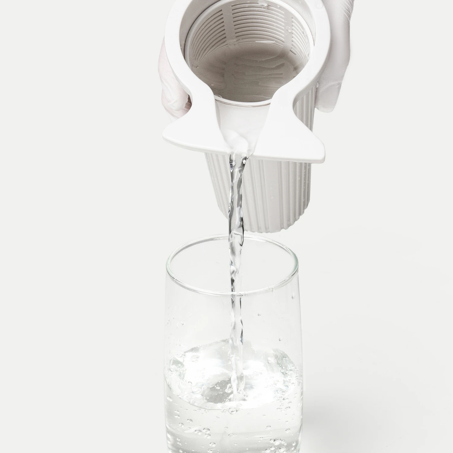 Pouring functional water from the ionizer into a glass